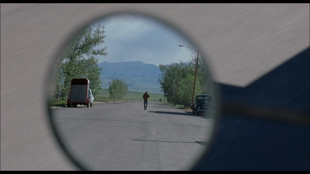 Figure 4. Jack’s rearview mirror POV of Ennis.