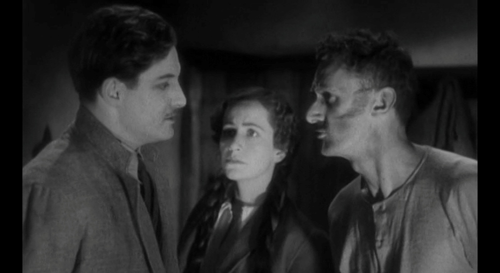 The removal of Pamela's wet stockings by the handcuffed pair.