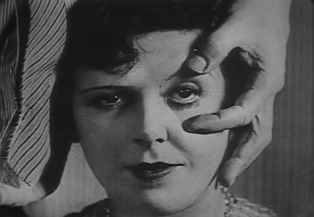 Luis Buñuel reaching toward Simone Mareuil's eye in the opening sequence of An Andalusian Dog.