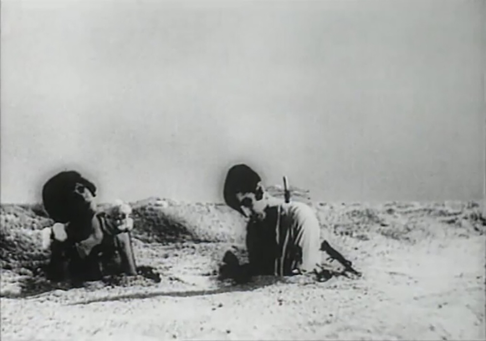 The woman and man partially buried in the limitless desert at the end of An Andalusian Dog.